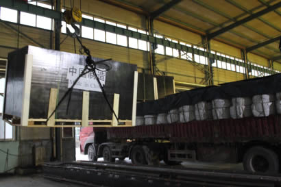 A black wooden box containing octagon inflatable rubber mandrels is lifting.