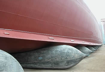 Several ship launching airbags are placed under a vessel and inflated waiting to launch the vessel