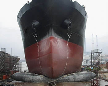 A vessel is launching using pneumatic marine airbags.